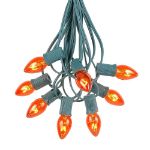 25 Light String Set with Amber/Orange Transparent C7 Bulbs on Green Wire